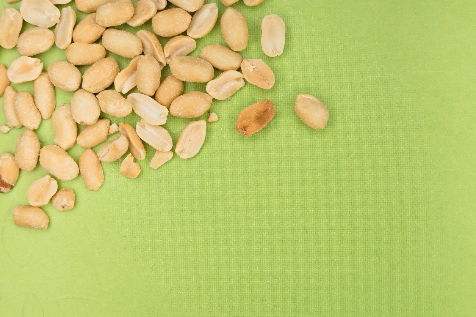 brown nuts on green surface