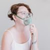 a woman using nebulizer